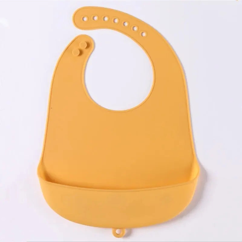 Yellow waterproof silicone baby bib with a catch pocket