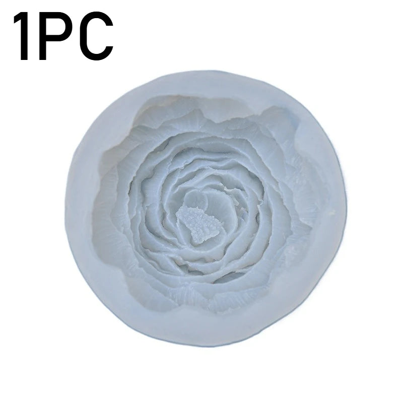 A single piece of white silicone mold shaped like a tightly spiraled peony flower for baking or crafting.