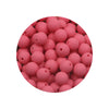 A close-up view of a pile of pink silicone beads for DIY jewelry making.