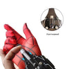 A hand holds a black electric auto-retractable wrist-mounted web shooter with red elastic band design.