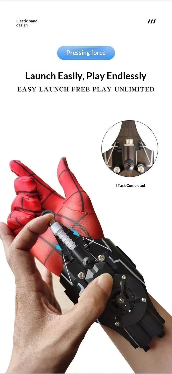 A hand holds a black electric auto-retractable wrist-mounted web shooter with red elastic band design.