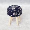 A navy blue floral patterned mini sofa and pillow set for a dollhouse