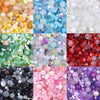 A collection of vibrant glass beads in various colors including blue, green, pink, purple, and red for DIY jewelry making