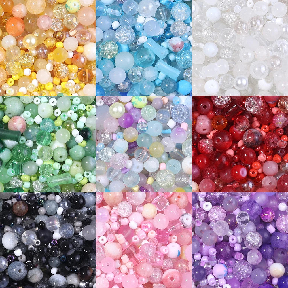 A collection of vibrant glass beads in various colors including blue, green, pink, purple, and red for DIY jewelry making