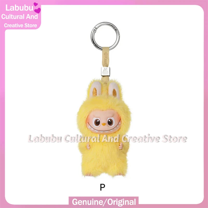 Yellow Labubu plush doll with long ears attached to a silver keychain ring