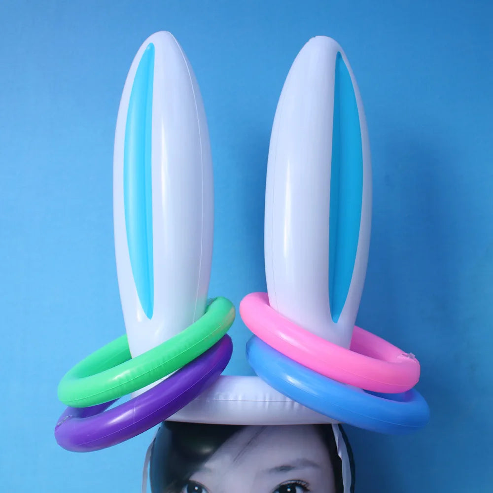 A set of white plastic Easter egg and spoon race game pieces with blue and pink accents.