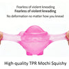 A pink TPR mochi squishy toy is shown being squeezed, emphasizing its fearless kneading and no deformation features.