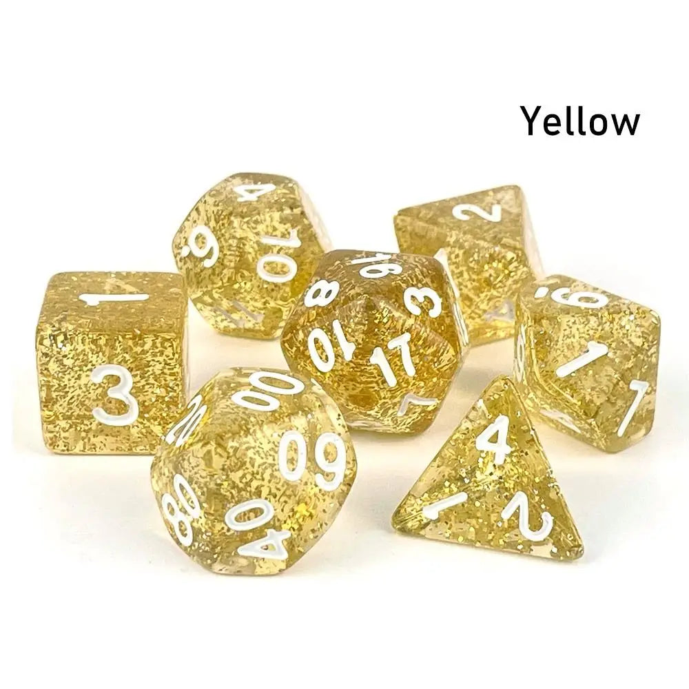 A set of seven yellow polyhedral acrylic dice, including d6s and d10s, scattered on a white surface.