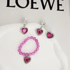 A set of five pink and silver princess jewelry accessories including earrings and a necklace displayed on a white background.