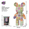 A colorful bear figure made of micro building blocks and beads, packaged with instructions.