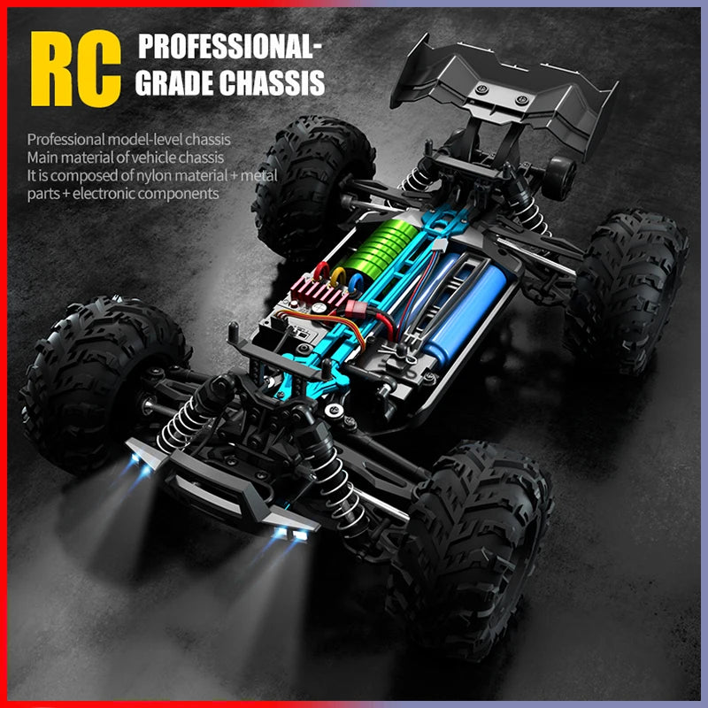 A professional-grade RC monster truck chassis with large tires and blue components, illuminated by bright LED headlights.