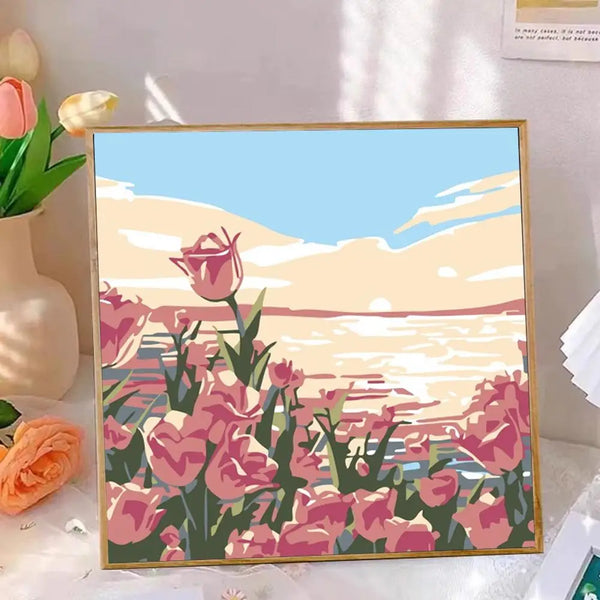 Måla efter siffror-kit med en livfull rosa och lila blomsterlandskap under orange solnedgångshimmel