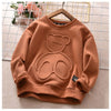 A brown kids cartoon bear pullover sweatshirt with a round design on the chest is displayed on a light background.