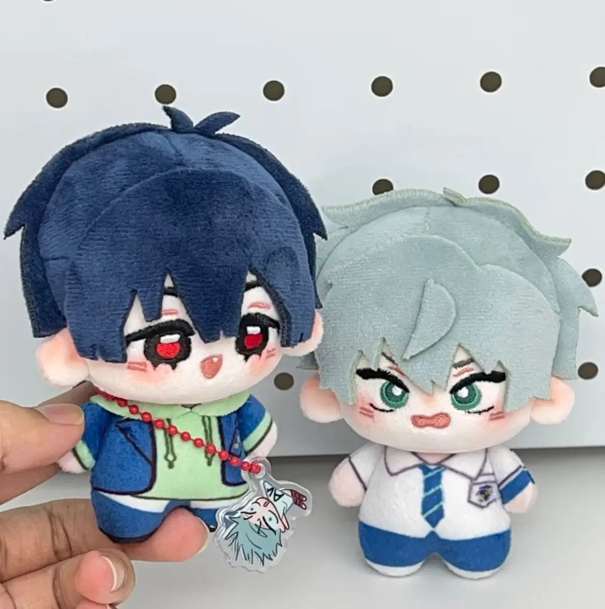 Two chibi plush keychains of Ivan and Till from Alien Stage featuring blue hair and detailed outfits