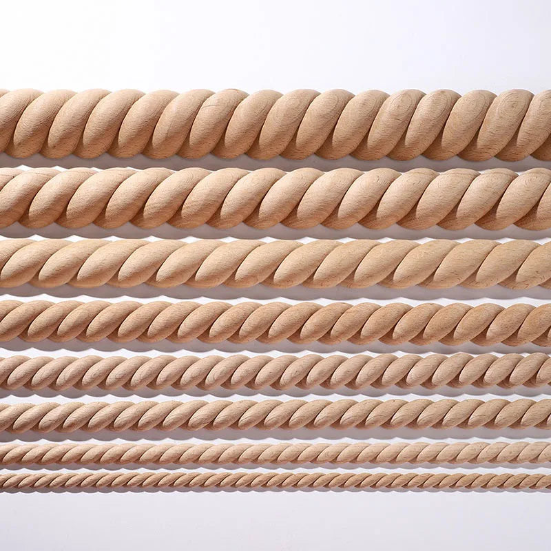 A row of vintage wood carved applique pieces in a light tan or natural wood color.