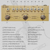A yellow multi-effects guitar and bass pedal with various knobs and switches labeled for volume, effects, and tone control.