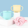 A set of BPA-free silicone snack cups in pale yellow and light blue with lids displayed on a white surface.