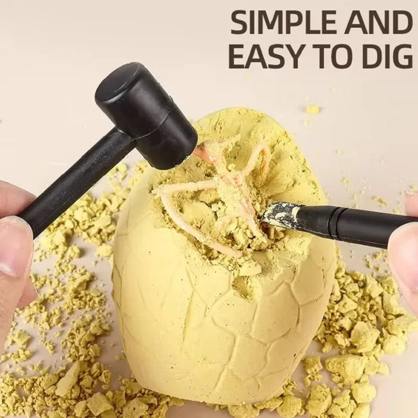 A hand is using a hammer to excavate a fossil from a yellow clay dinosaur egg mold.