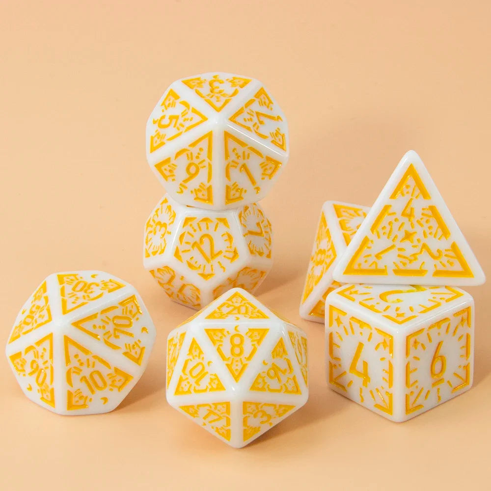 A set of seven polyhedral dice in white and orange geometric patterns resting on a light beige surface.
