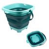 A teal and dark gray expandable sand bucket toy for toddlers with a handle.