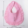 Pink ruffled muslin cotton baby bib with adjustable snap closure