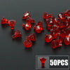 A pile of red gemstone building blocks shaped like coins, with a small box indicating 50 pieces.