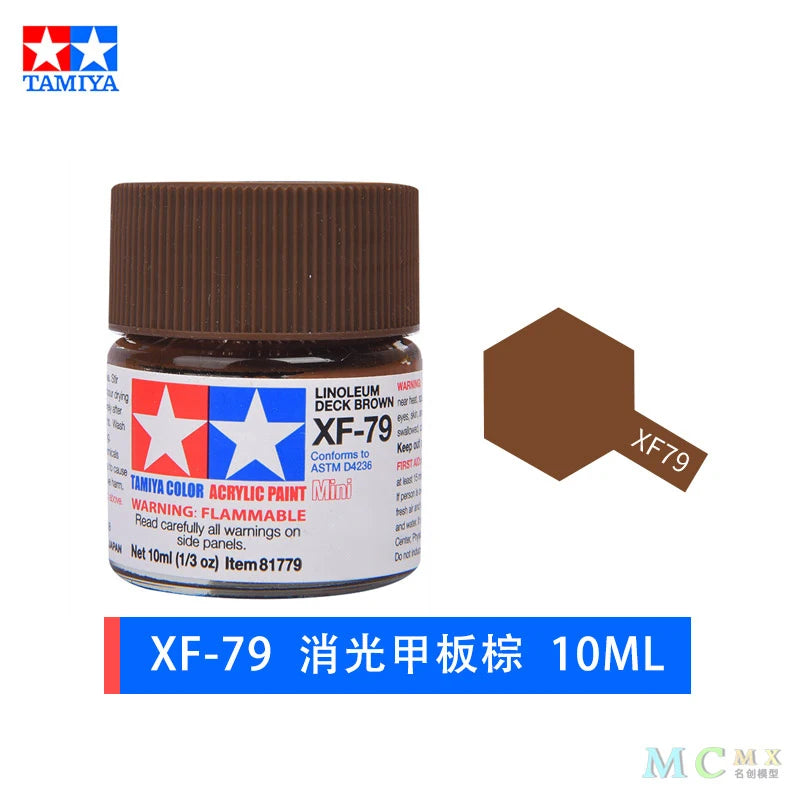 A glass jar of XF-79 acrylic paint in a brown lid, labeled as 10ml.