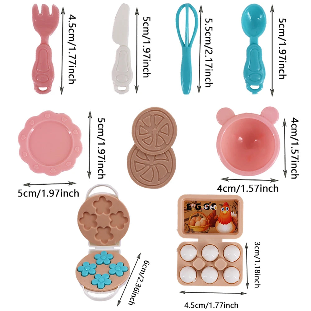 A set of doll feeding and care accessories including a pink fork, a white knife, blue and green spatulas, pink plates, and va
