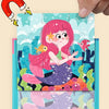 A colorful magnetic jigsaw puzzle featuring a mermaid, fish, and fruit elements for children's learning.