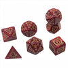 A set of red polyhedral dice featuring dragon designs used for tabletop role-playing games