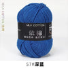 A ball of bright blue milk cotton yarn labeled with Chinese characters and a size designation.