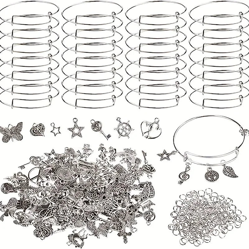 A collection of 90 pieces of silver-tone jewelry making components including bangles, charms, and findings.