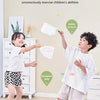 Children playing with a foot launcher flying disc toy set and catching nets to work on body coordination.