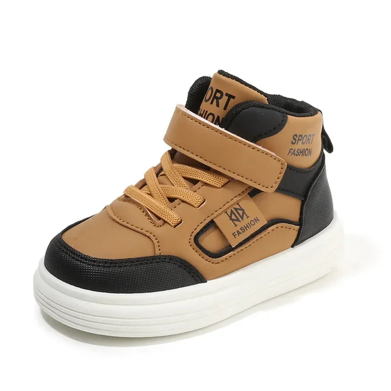 A pair of tan and black kids' high-top sneakers with easy velcro straps.