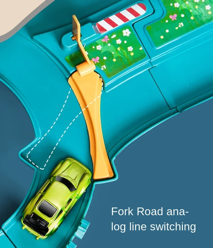 An orange fork used for analog line switching is shown on a teal playset with a green car.