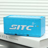 A light blue industrial storage box labeled SITC resting on a white book.