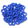 A pile of bright blue acrylic doughnut spacer beads for jewelry making