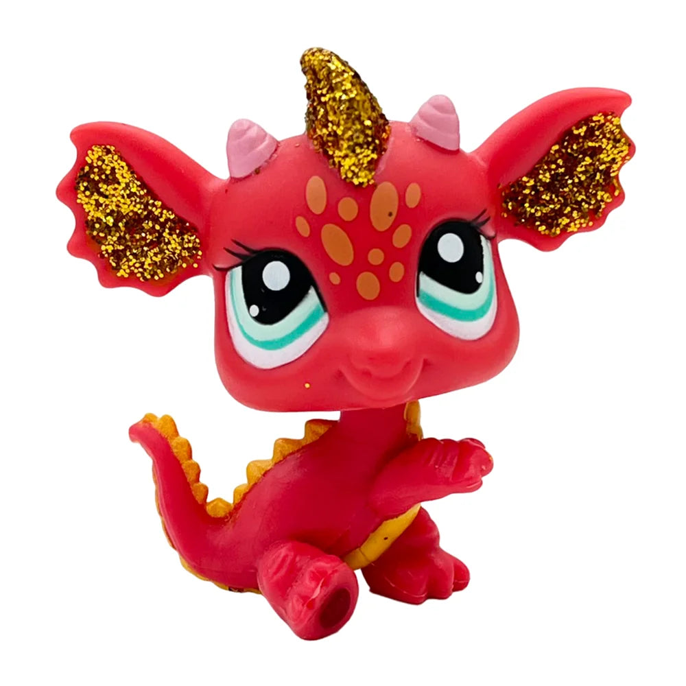 Eine kleine, leuchtend rote Sammler-Katzenfigur mit goldenen Akzenten auf Kopf und Körper.