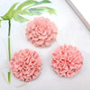 Three pink floral 3D silicone molds for candles, soap, and baking displayed on a white surface with green leaves.