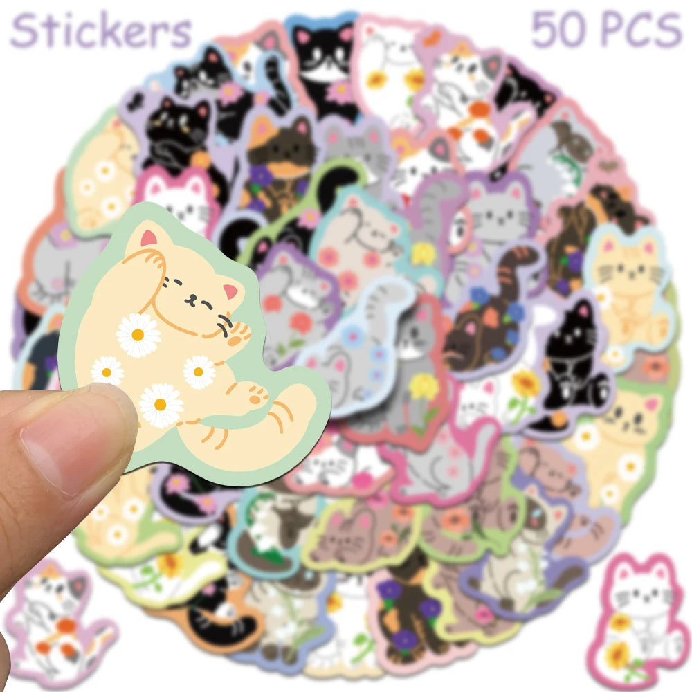 A circular arrangement of 50 cute cartoon cat stickers in various colors and styles.
