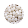 A circular arrangement of white silicone beads in various sizes for DIY jewelry making