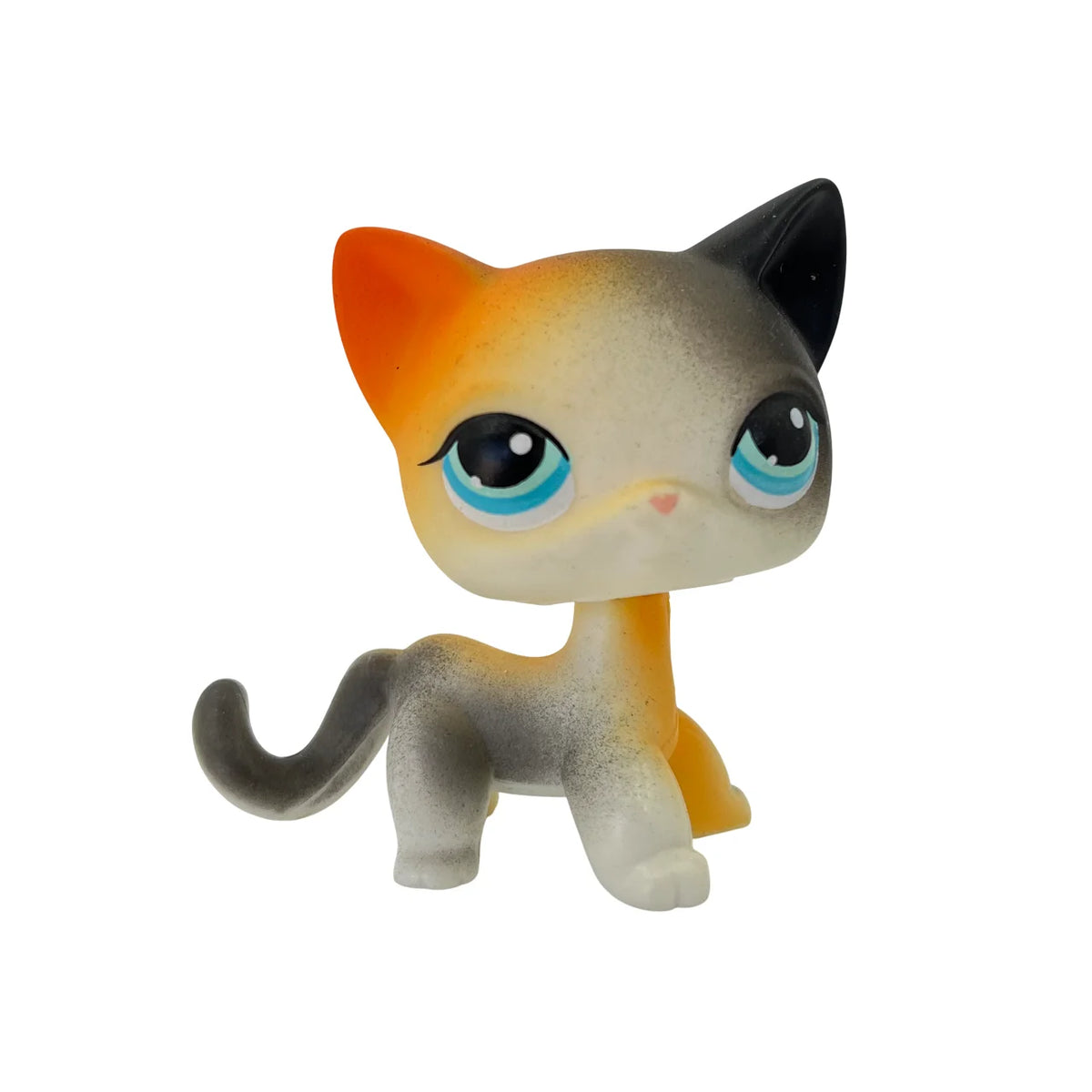 A charming bobble head pet figurine of a cat with orange and gray fur and large blue eyes.