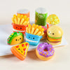 Assorted pack of 12 mini food squishy toys including a corn, egg, and donut shaped item
