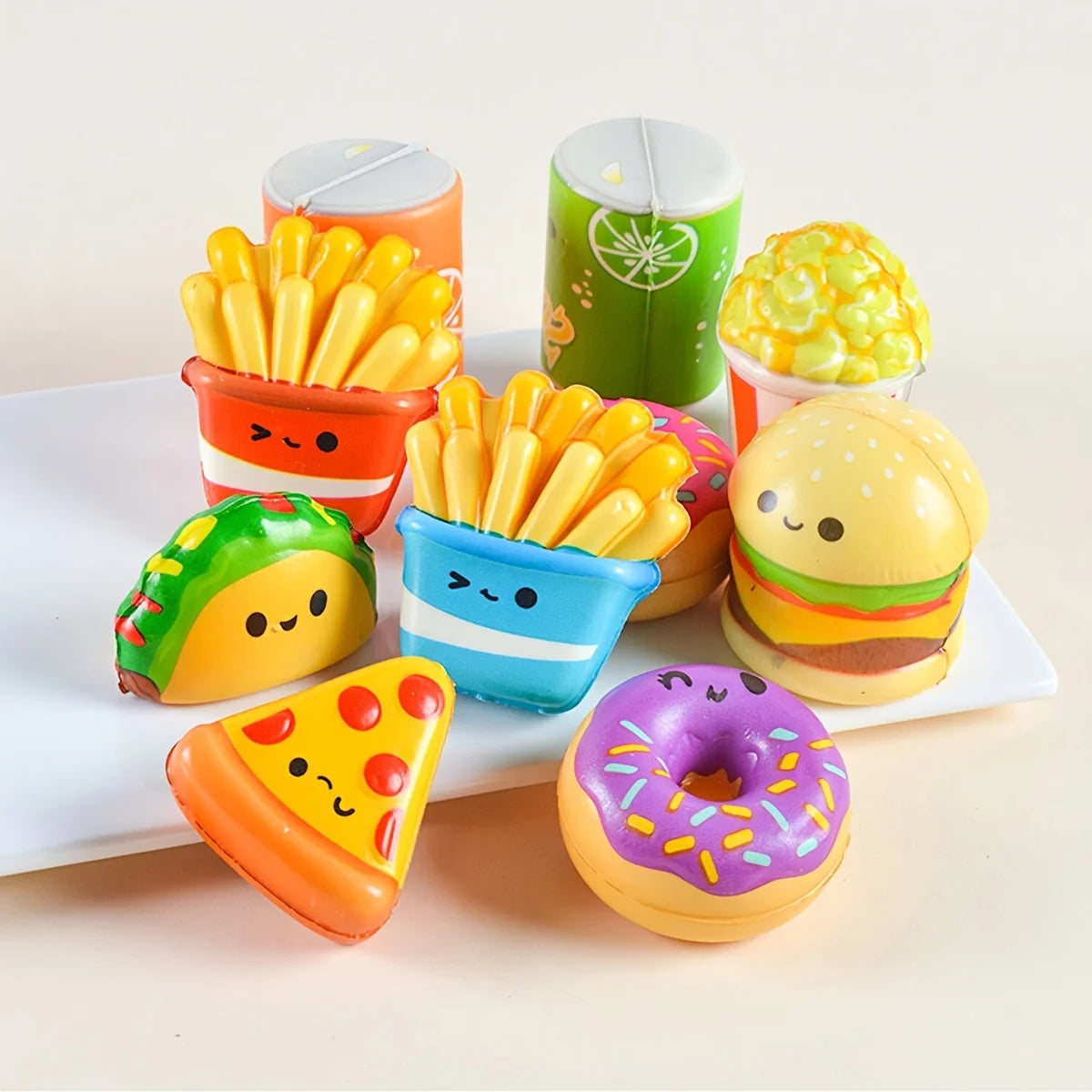 Assorted pack of 12 mini food squishy toys including a corn, egg, and donut shaped item