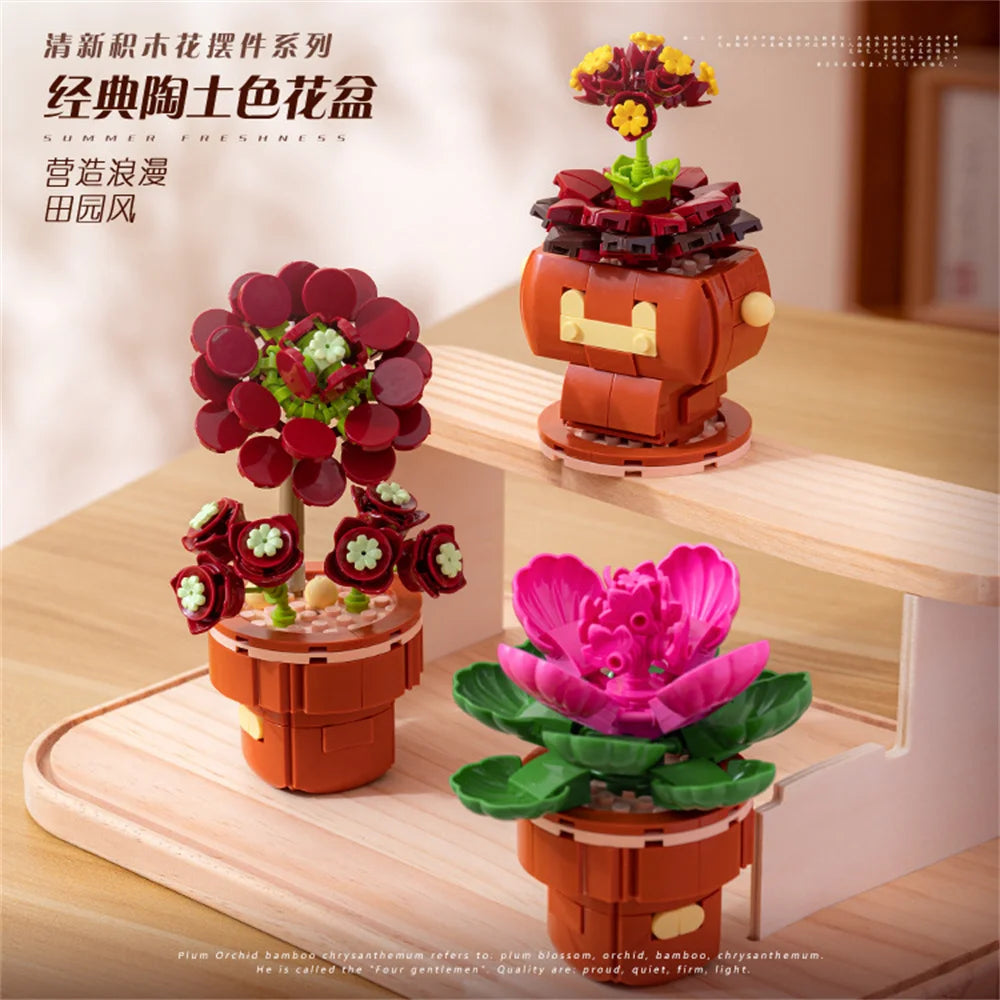 A set of ceramic building blocks depicting a flower arrangement with red and pink petals on a wooden base.