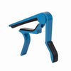 A blue aluminum alloy quick-change guitar capo with a black cap.