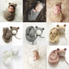 A set of knit bear hat and wrap for a newborn, featuring various shades of brown and beige.