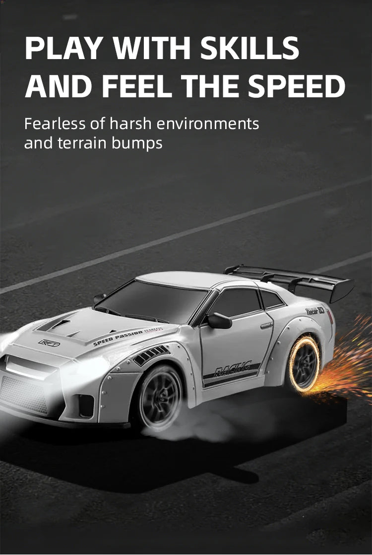 A white RC drift car is shown driving on a dark surface, kicking up smoke and tire marks.