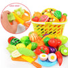 A colorful pretend play kitchen set featuring plastic fruits and vegetables for kids to cut and play