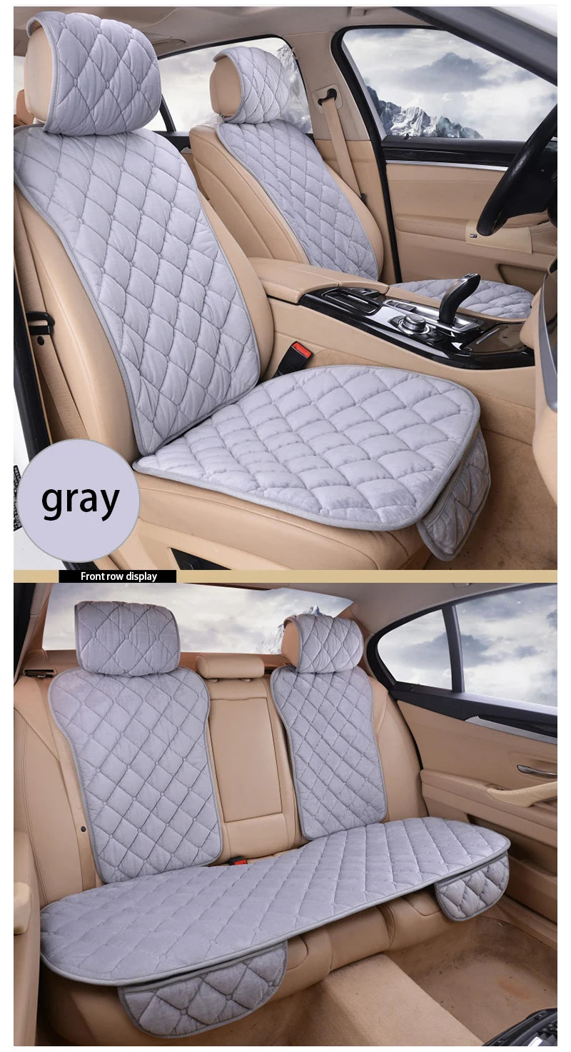Gray universal car seat protector with quilted fabric and anti-slip backing shown in a vehicle interior.
